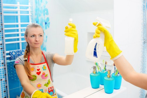 Professional carpet cleaner working in a Sutton home hallway