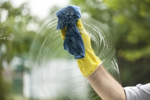 Domestic cleaning service working in a Sutton kitchen